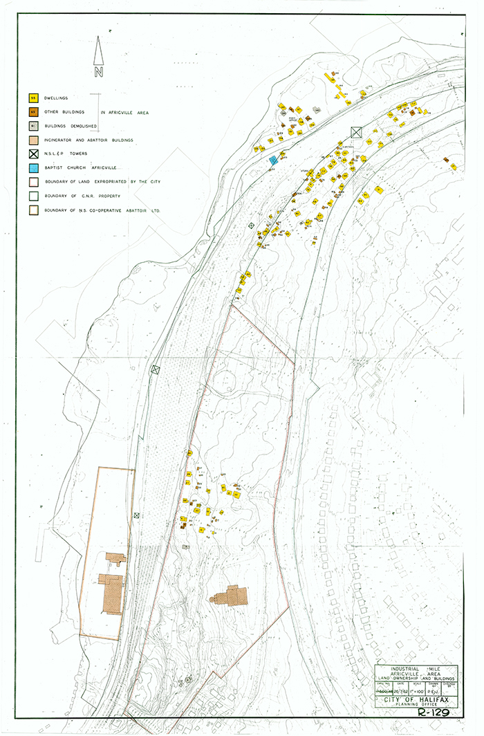 Colour photo of map showing residential dwellings, buildings, boundary lines, and the church. Legend in upper left hand corner.