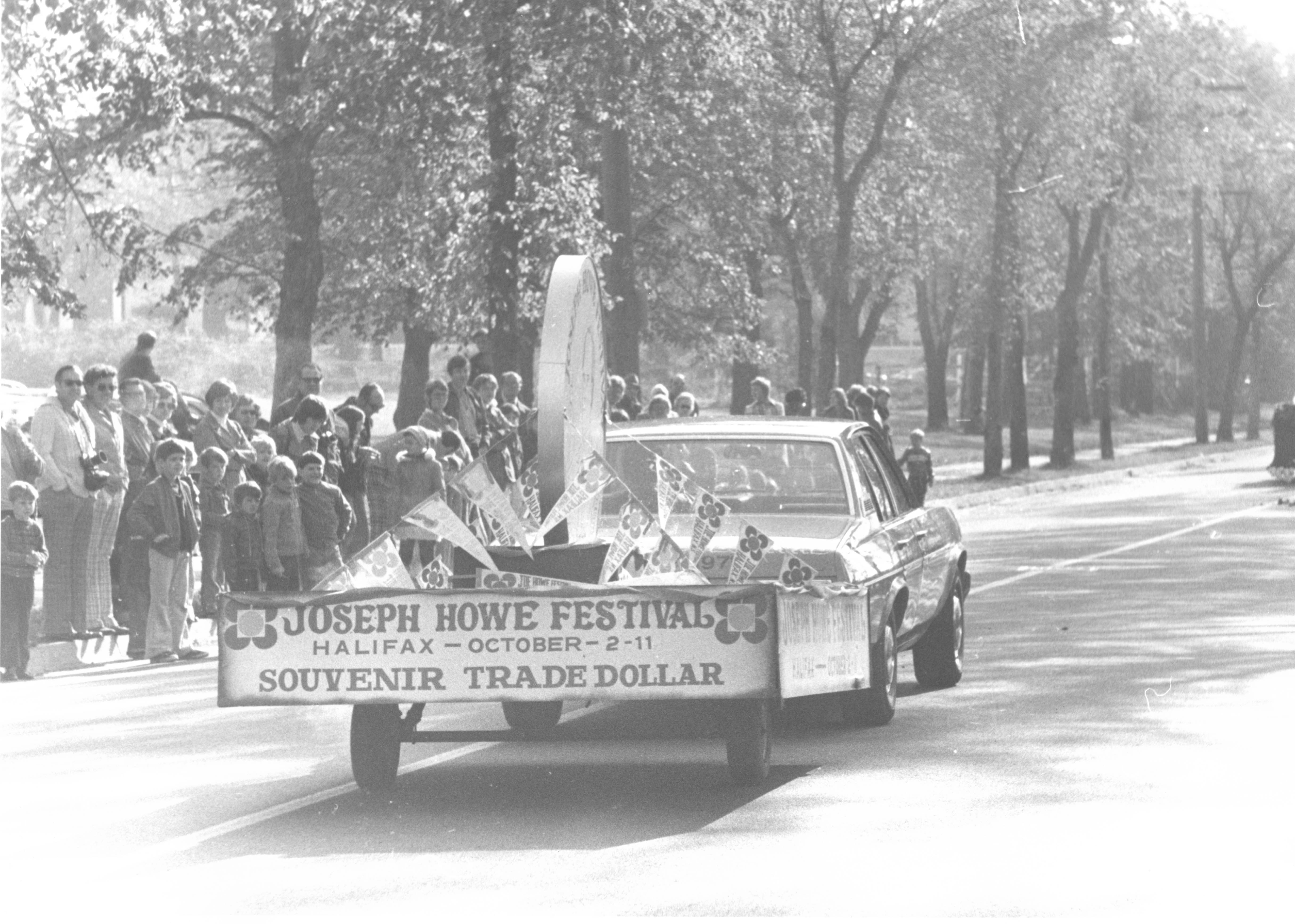 Black & white photo of parade crowd