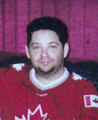 Bruce Andrew Forbe picture in red hockey jersey
