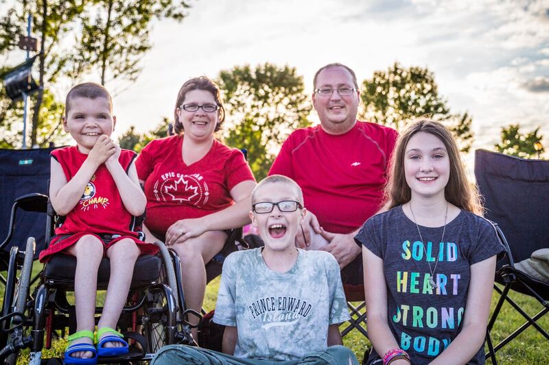 A family smiling, enjoying the activities at Bedford Days