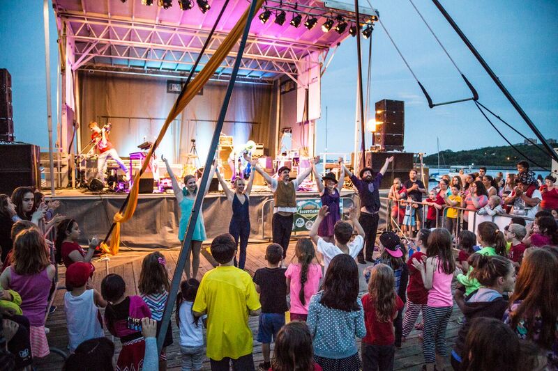 An entertainment act bows on the stage at Bedford Days.