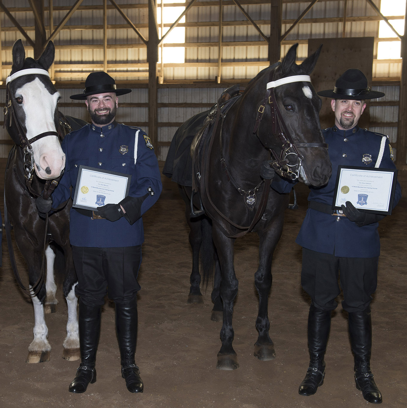 Photo of police horse, Duty Sergeant, with partner, Constable Ryan Morash and police horse, Valour, with partner, Constable David Gallivan