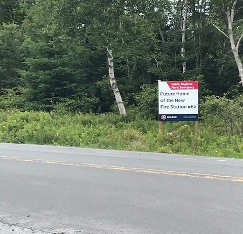 Sign on the side of Old Sambro Road indicating the new location for Fire Station 62
