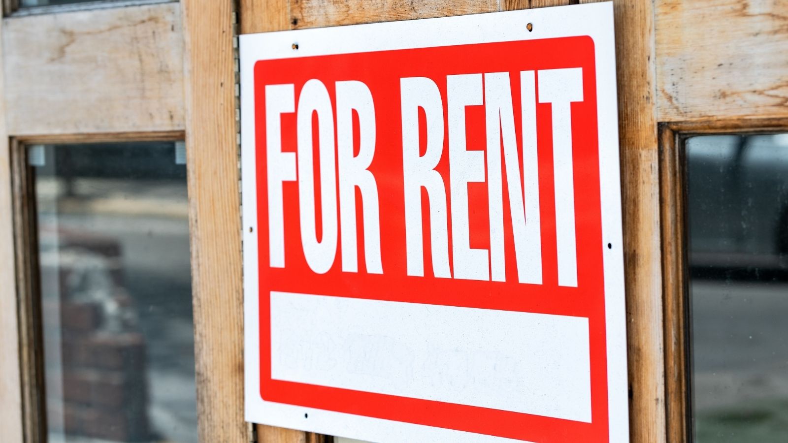An image of a red "for rent" sign