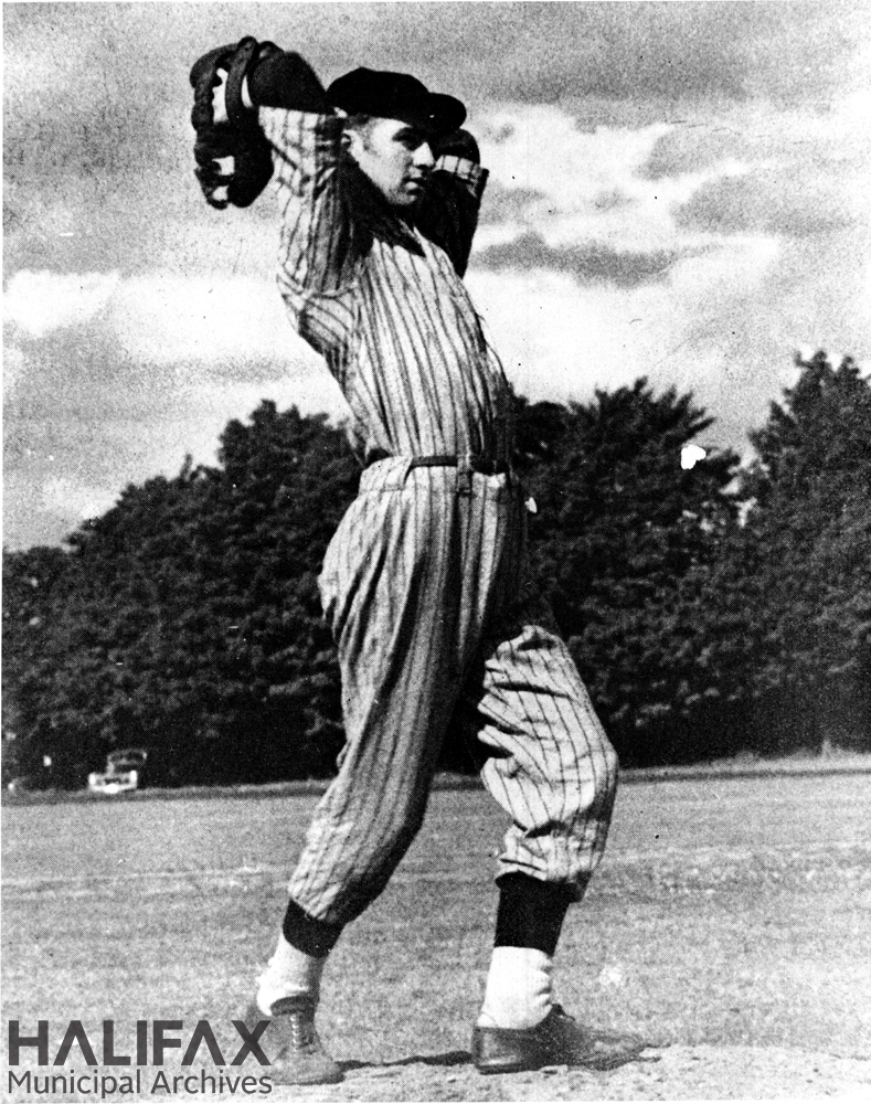 Black and white image of a baseball pitcher