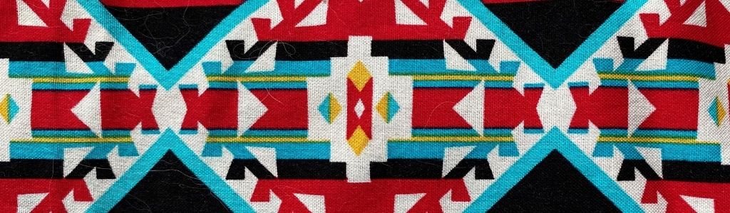 a colourful cloth patterned with traditional Indigenous designs