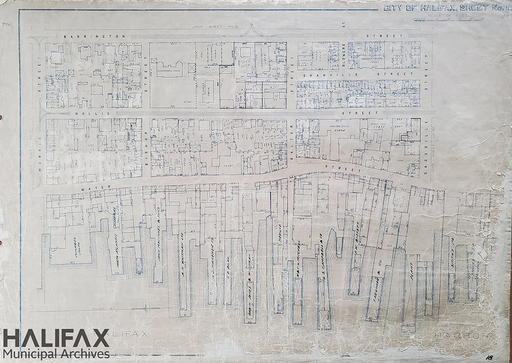 Map of downtown Halifax showing Barrington, Hollis, and Lower Water streets between Morris and Sackville. Shows building footprints, streets, and wharves.