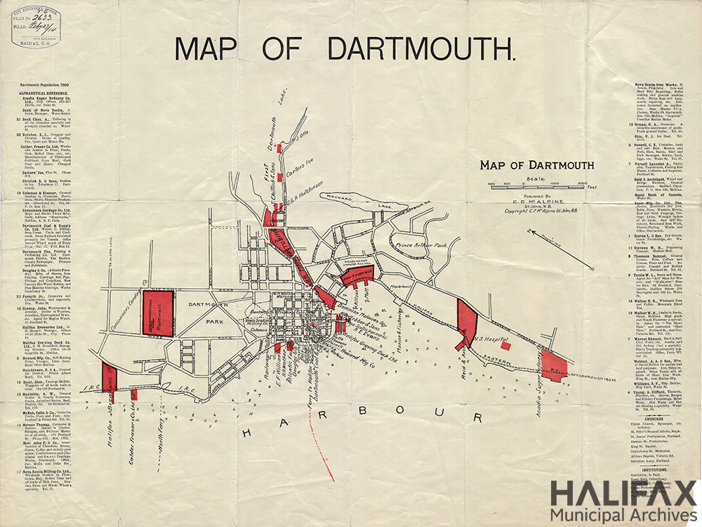 A map of Dartmouth with lists of businesses and shops on either side of the map. 