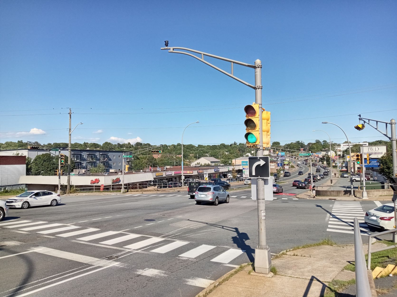 Zebra style marked crosswalk painted in the intersection of Main Street and Major Street in Dartmouth