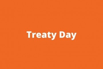 Orange background with the words Treaty Day in white text