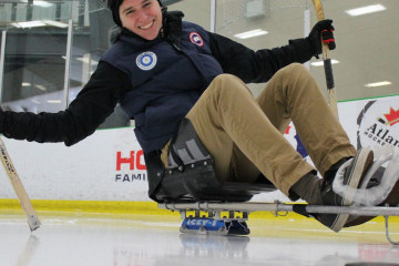 Woman on sledge on ice