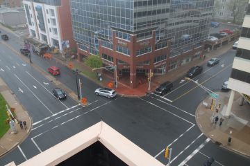 a bird's eye view of the Ochterloney Street and Alderney Drive intersection on a cloudy day