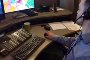 911 call taker at his computer