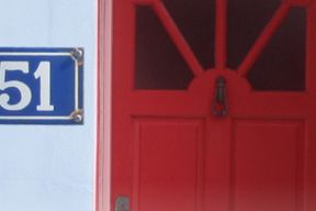 House with red door and the house number 51 clearly displayed