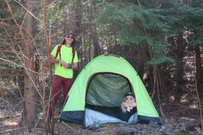 two people in a tent learning about wilderness basics