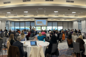 Conference delegates gather in the ballroom for keynote presentation 