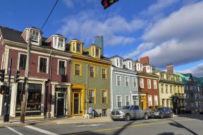 A row of houses with heritage designation on Morris Street, as seen from the corner of Morris and Hollis Streets