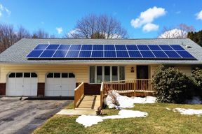 A solar panel on the roof of a home